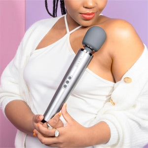 Wand vibrator, girl holding grey wand massage vibrator, best wand massager, magic rechargeable wand vibrators, vibration therapy tool, what is the best wand vibrator, powerful vibrator, magic wand vibrators buyers guide, is the wand massager a vibrator?, rechargeable magic wand vibrator review, best vibrator, le wand vibes, best vibrators, how to use a vibrator, bdsm wand, massage wand tool