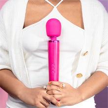 Load image into Gallery viewer, Wand vibrator, girl holding magenta pink le wand massage vibrator, best wand massager, magic rechargeable wand vibrators, vibration therapy tool, what is the best wand vibrator, powerful vibrator, magic wand vibrators buyers guide, is the wand massager a vibrator?, rechargeable magic wand vibrator review, best vibrator, le wand vibes, best vibrators, how to use a vibrator, bdsm wand, massage wand tool