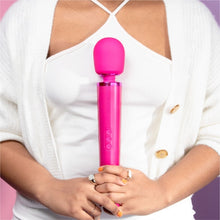 Load image into Gallery viewer, Wand vibrator, girl holding magenta pink le Wand massage vibrator, best wand massager, magic rechargeable wand vibrators, vibration therapy tool, what is the best wand vibrator, powerful vibrator, magic wand vibrators buyers guide, is the wand massager a vibrator?, rechargeable magic wand vibrator review, best vibrator, le wand vibes, best vibrators, how to use a vibrator, bdsm wand, massage wand tool