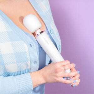 Wand vibrator, girl holding pearl white le wand massage vibrator, best wand massager, magic rechargeable wand vibrators, vibration therapy tool, what is the best wand vibrator, powerful vibrator, magic wand vibrators buyers guide, is the wand massager a vibrator?, rechargeable magic wand vibrator review, best vibrator, le wand vibes, best vibrators, how to use a vibrator, bdsm wand, massage wand tool