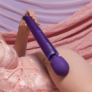 Wand vibrator, girl holding purple Le Wand massage vibrator, best wand massager, magic rechargeable wand vibrators, vibration therapy tool, what is the best wand vibrator, powerful vibrator, magic wand vibrators buyers guide, is the wand massager a vibrator?, rechargeable magic wand vibrator review, best vibrator, le wand vibes, best vibrators, how to use a vibrator, bdsm wand, massage wand tool